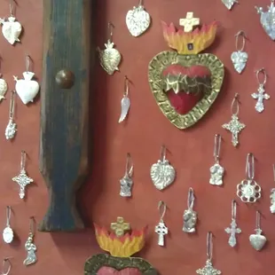 I'm obsessing over milagros and this is where I first discovered them...you can purchase them at the register for a few cents ea