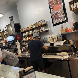 two men preparing food