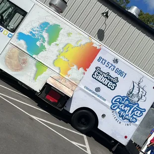 a map of the world on the side of the truck