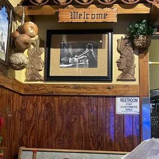 a restaurant counter with a sign that says thank you