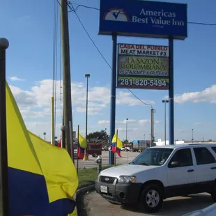 Colombian flags in the entrance and the sign.