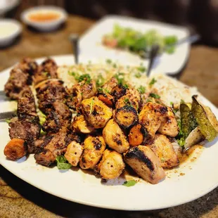 Family platter with chicken &amp; beef, almond rice &amp; veggies.