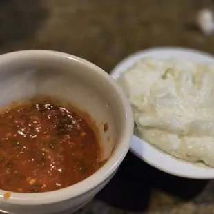 Housemade 'salsa' and garlic dip.