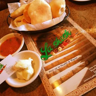 a plate of bread and dipping sauces