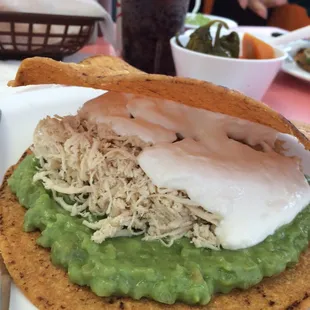 Tostada la Siberia with crema, guacamole! Yummy