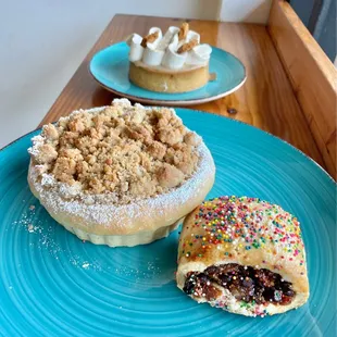 Apple pastry (apple pie filling under buttery crumb topping) + Italian cookie (candied orange/fig center)