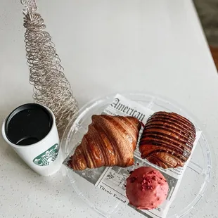 Croissant, chocolate croissant, and raspberry cookie