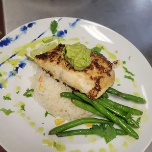 Rockfish over herb sautéed green beans whith cilantro emulsion, and topped with pickled red onions.