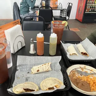 a table full of food and drinks