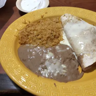 Chicken quesadilla with beans and rice. I added sour cream and it was so awesome!!