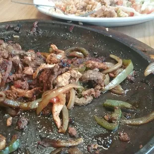 Whats left of the faita for 2 with shrimp, chicken, steak and chirizo,  awesome