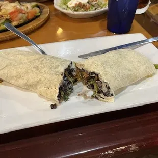 Veggie burrito. I asked for black beans and grilled peppers. Very Good.   Asked for no queso but forgot to say no Cheese so some instide.