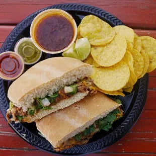 a sandwich and chips on a plate