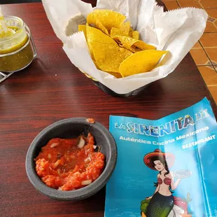 Complimentary chips and salsa, next to the menu