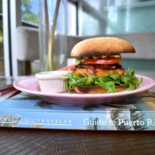 a plate of food and a book