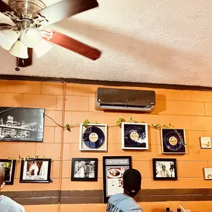 3 blue-plate awards on the wall.