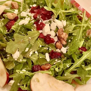 a salad with apples and cheese
