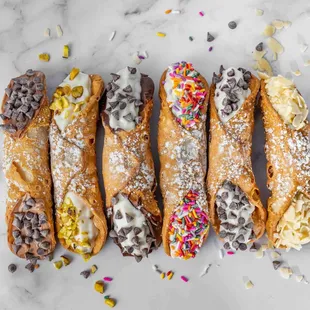 a variety of pastries on a marble surface