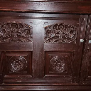 Hand-carved wood cabinet from the upstairs room
