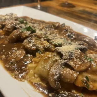 Beef rib ravioli and mushroom sauce