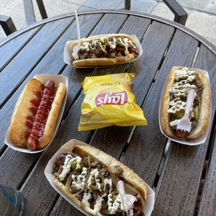 Asada dogs and a classic dog with only ketchup