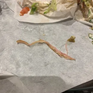 So many inedible chunks of this in my prosciutto panini. Thought I was chewing on paper at first but I kept biting into these pieces!