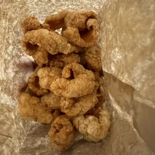 Pork rinds are cheap and good.