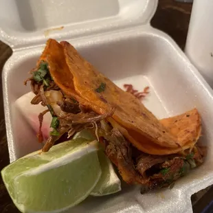 Quesabirria taco with consume on the side