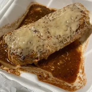 Wet burrito with obviously red sauce chicken beans and rice !!!