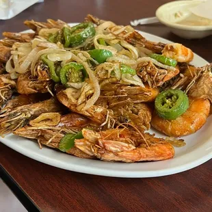 a plate of grilled shrimp