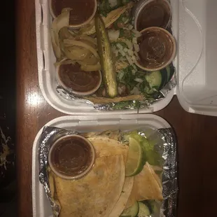 3 Steak tacos and a chorizo taco and tomatillo sauce. Also, a vegetarian quesadilla!