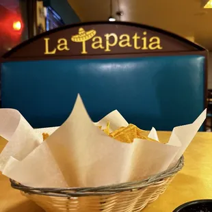a basket of chips and salsa