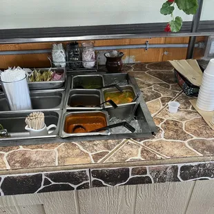 Salsa bar and pickles. Self serve.