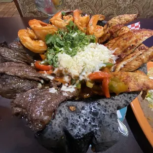 Trio Molcajete, no onions. The vegetables are in salt good!