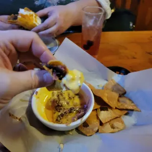 Dip taco in queso.  Thank me later.