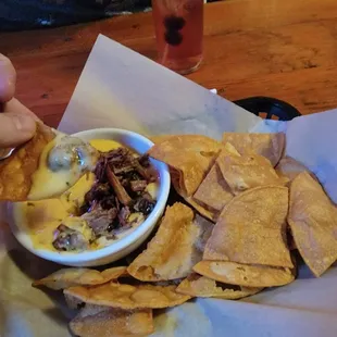 Chips and Queso with Brisket.