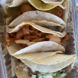 Cajun shrimp, pork belly, and carnitas tacos