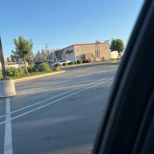 a view of a parking lot from a car window