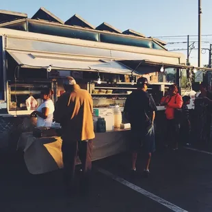 people ordering food from a food truck