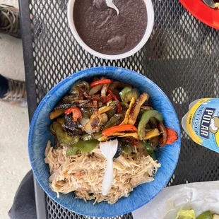 A la carte chicken, veggies, and Re-fried black beans.