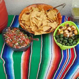 Chips, pico de gallo salsa and grilled onions and grilled jalapeno peppers
