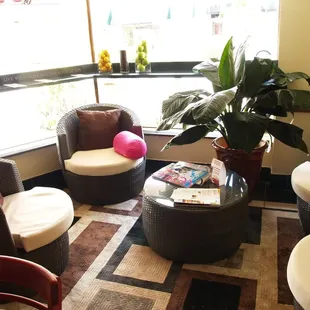 a living room with wicker furniture