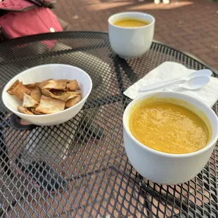 Sweet potato and corn soup and butternut squash soup with side of zaatar pita chips