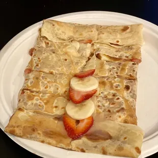 Create-Your-Own Crepe: Cookie Butter, strawberries, bananas, and white chocolate drizzle