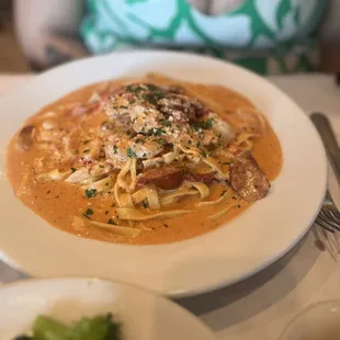 a plate of pasta and broccoli