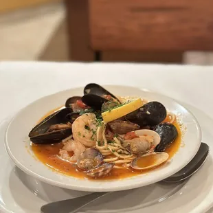 a plate of seafood and pasta
