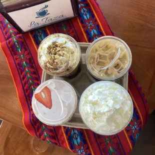 Dubai chocolate latte, Nutella latte with strawberry foam, vanilla latte, and a caramel frappe.