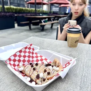Banana Strawberry Nutella Crepe and Almond Milk Latte in Background