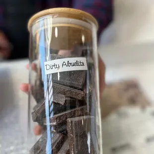 a person holding a jar of chocolate