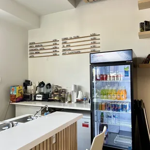 a kitchen with a refrigerator and a counter